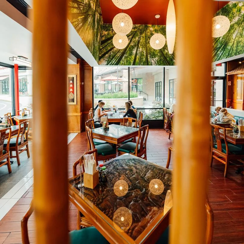 Dining area with ornamented tables and pillars